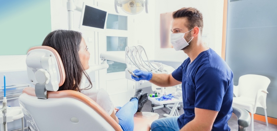 Dentist talking to a patient about dental services in Jackson